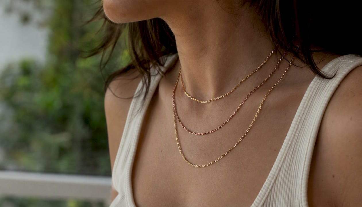 Layered necklaces with mixed metals and lengths