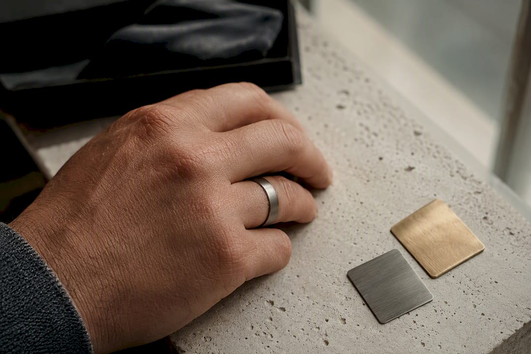 Cropped finger wearing a discreet smart ring