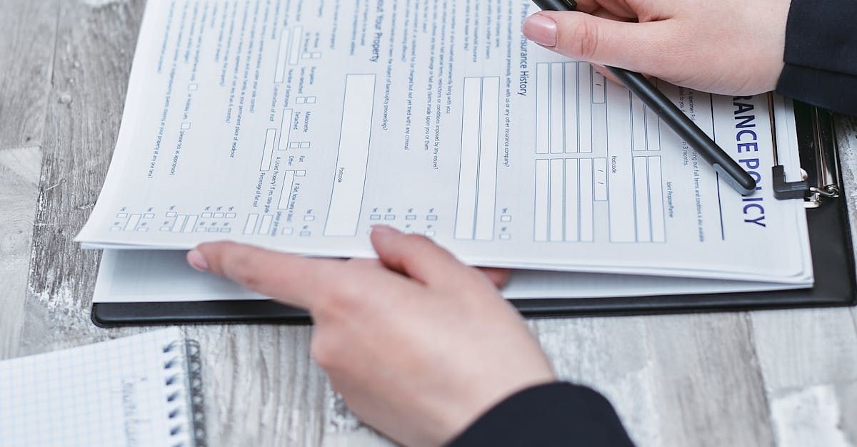 Business owners reviewing compliance documents and digital sign mockup