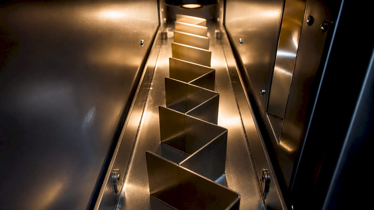 Close-up of anti-fishing baffle inside safe slot
