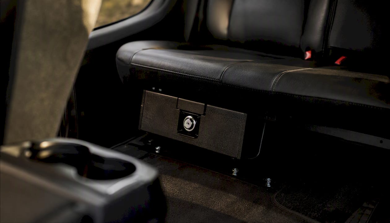 Compact firearm lockbox bolted in vehicle