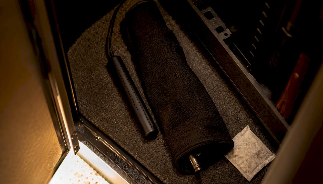 Firearm locker interior with dehumidifier rod and desiccant