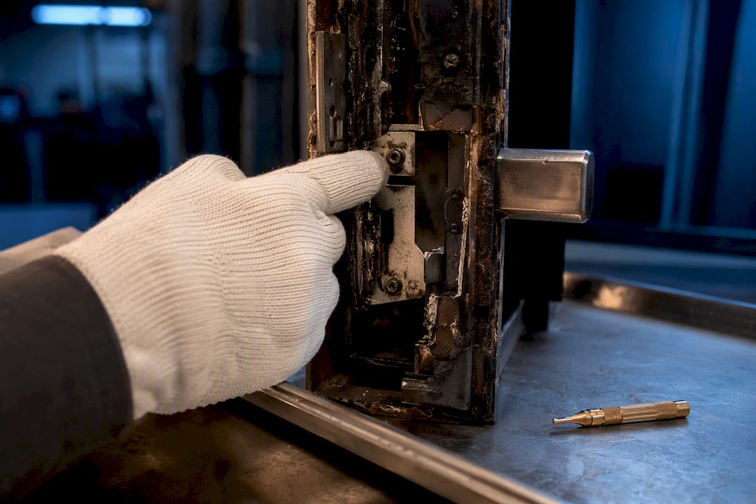 Inspector checking fire safe locking hardware