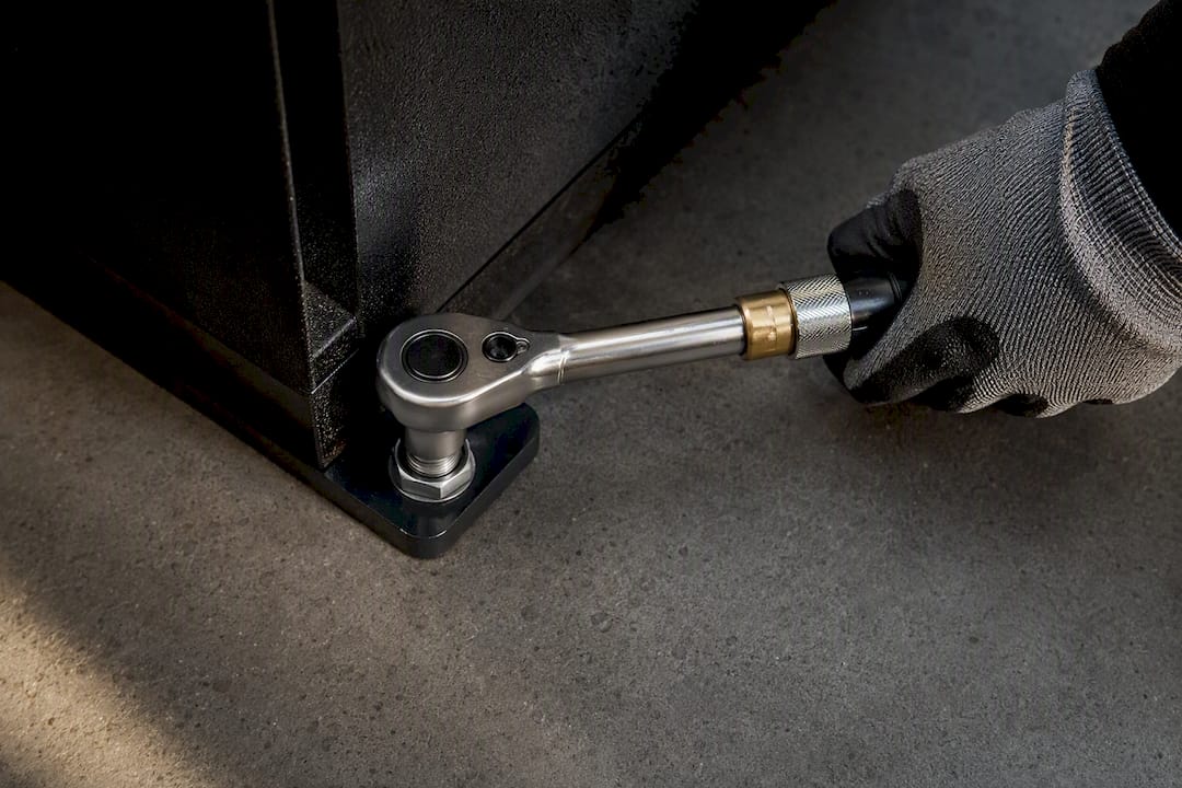 Anchor bolt securing a safe to concrete