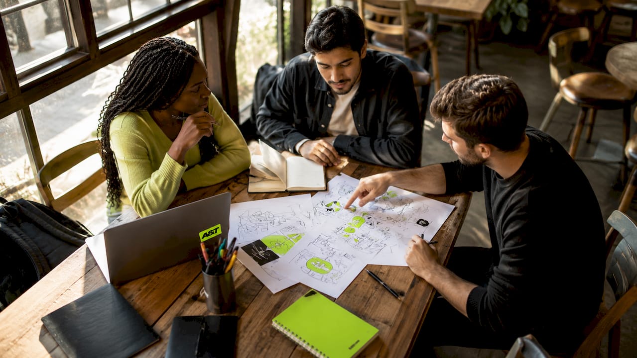 Small marketing team collaborating on ad production