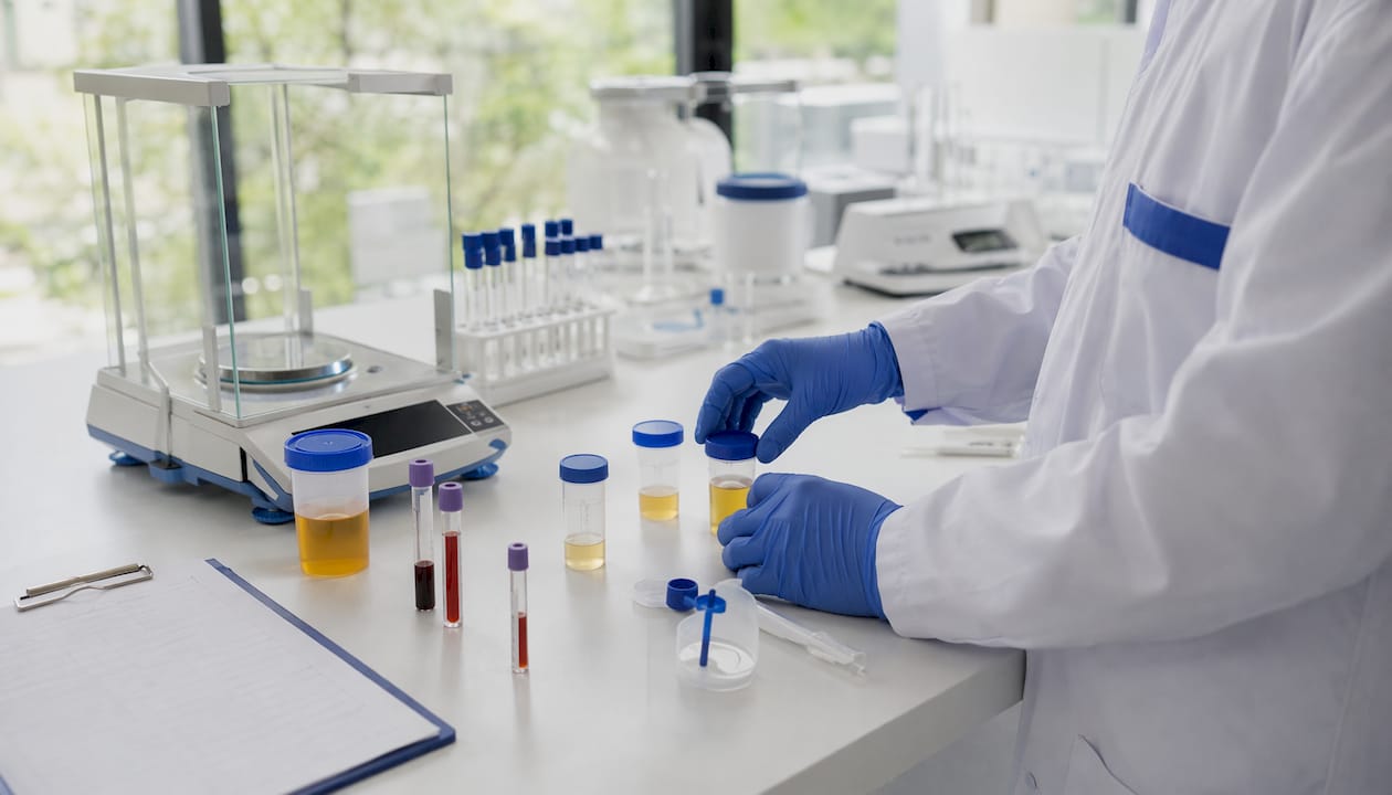 Forensic scientist handling different specimen types