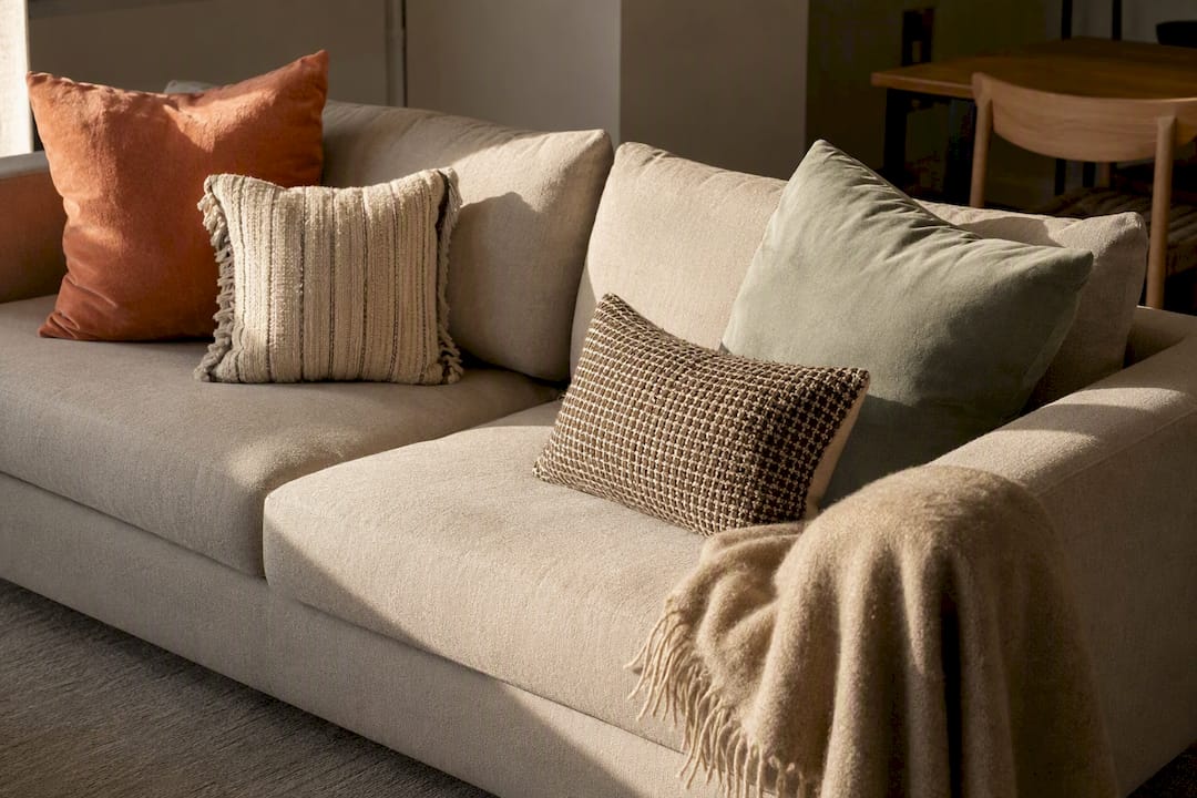 Asymmetric cushion arrangement on modern sofa
