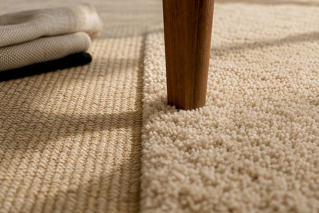 Furniture leg over contrasting rug piles
