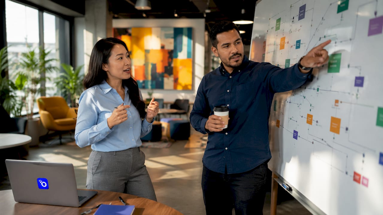 Colleagues discussing data inventory map in office