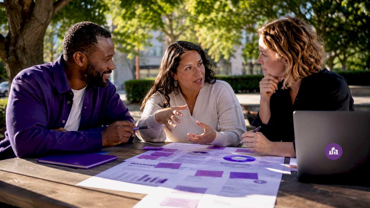 Group discussing marketing strategies at coworking table