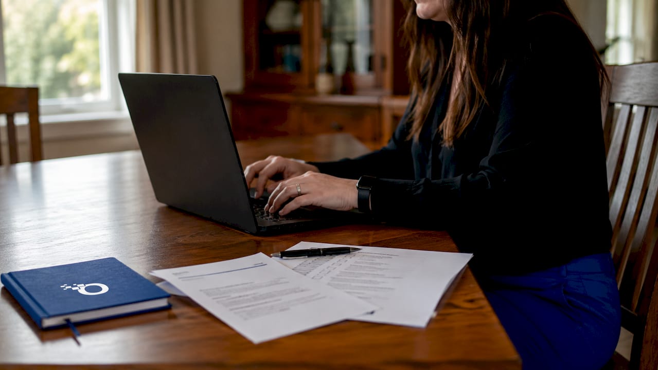 Hands typing adverse action notification