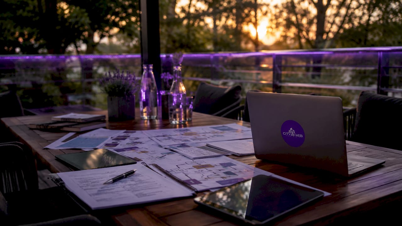 Boardroom table with SEO planning charts and devices