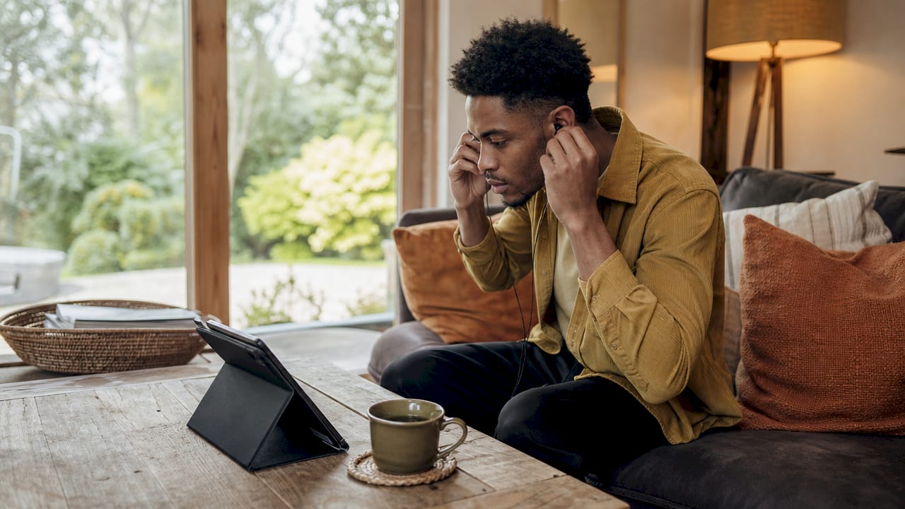 Man setting up tablet for virtual health consult