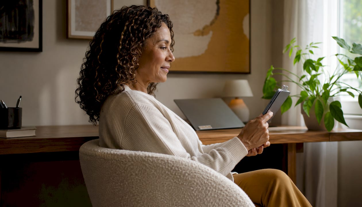 Woman using tablet for telehealth hormone therapy consultation
