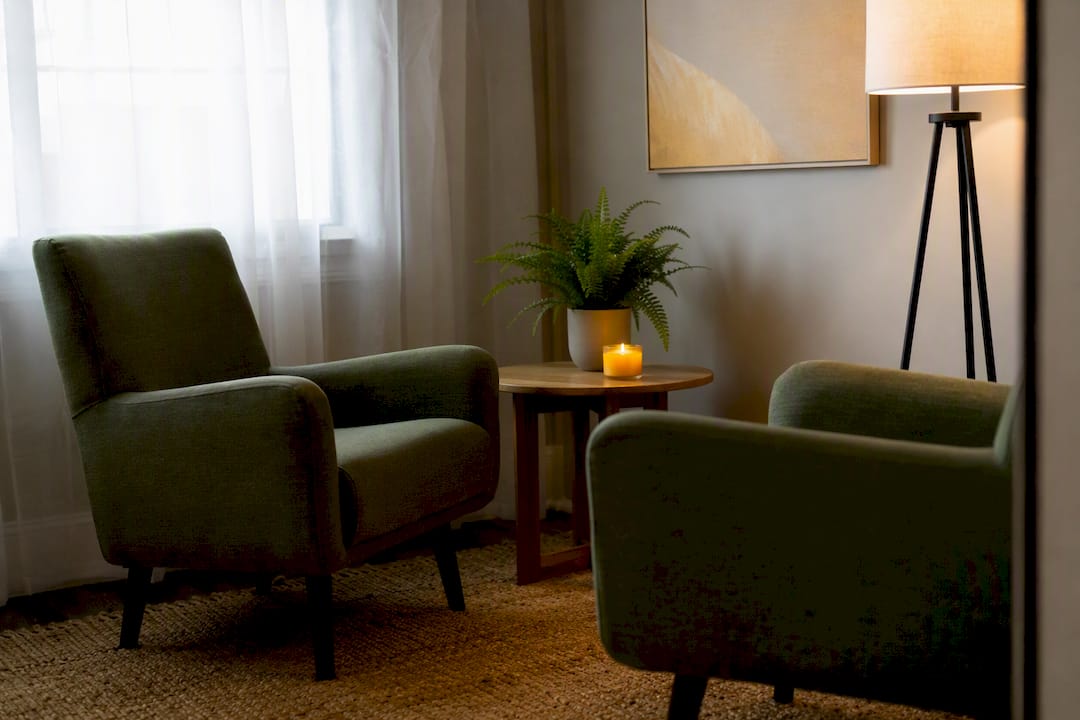 Empty counseling waiting area with blue chairs