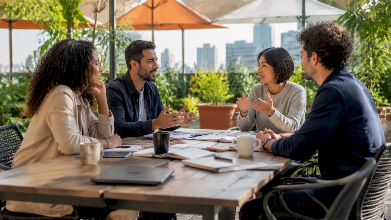 Diverse team collaborating around table in office