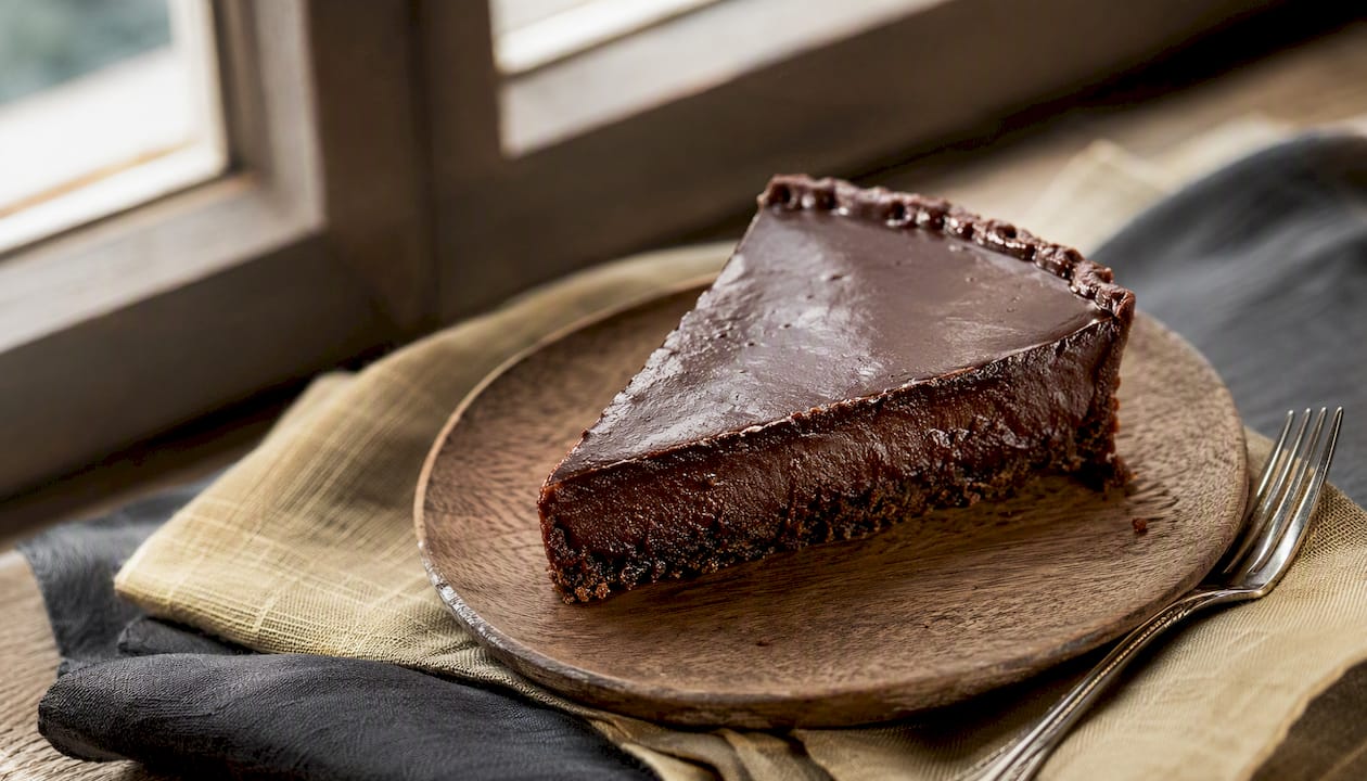 Flourless dark chocolate tart sliced