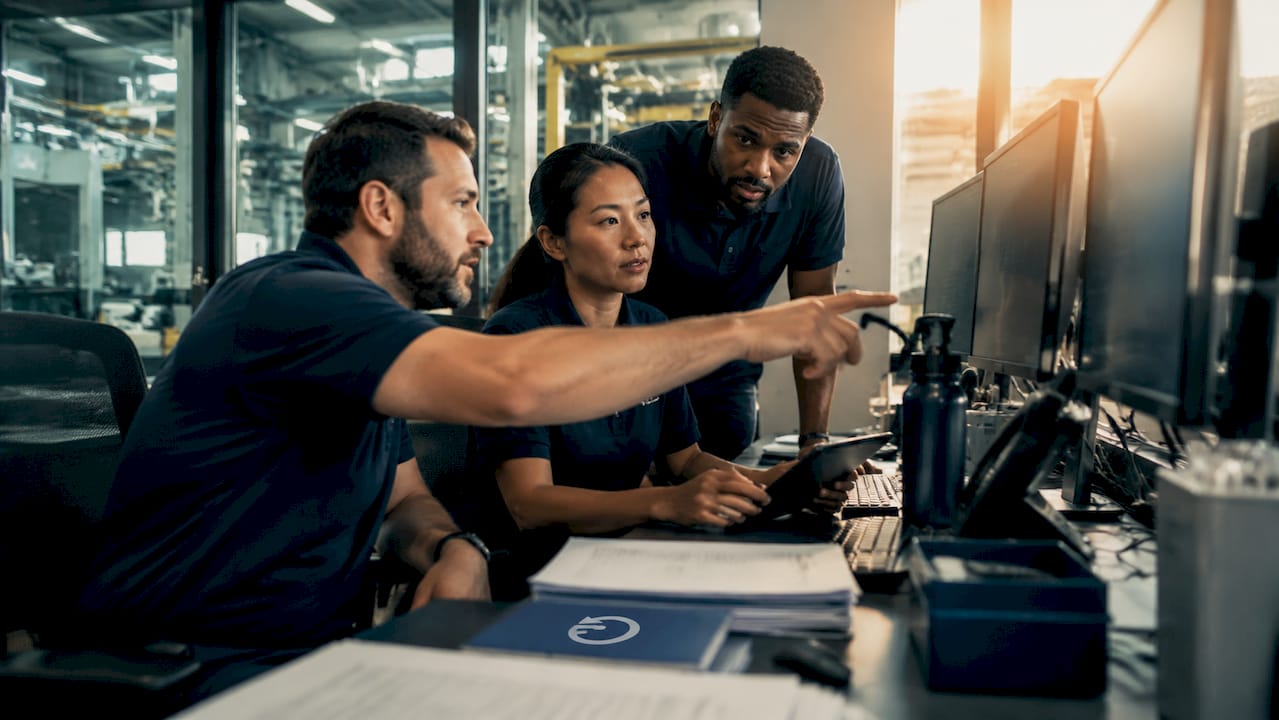 Operations team reviewing machine downtime data