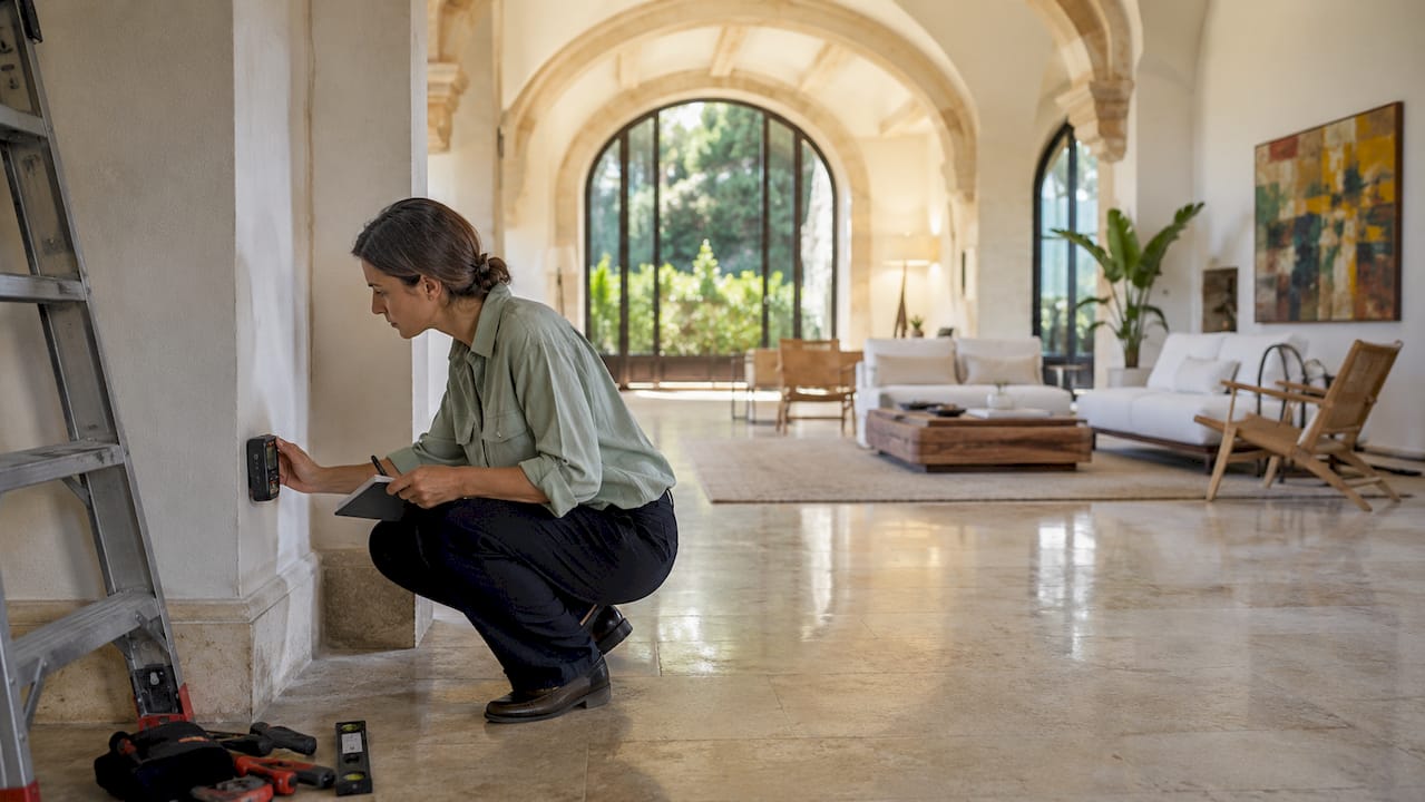 Architect performing technical inspection in villa