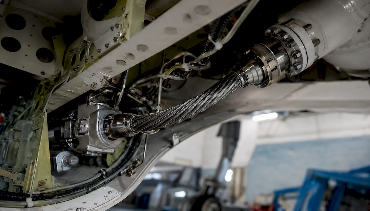 Flexible shaft routed inside aerospace actuation system