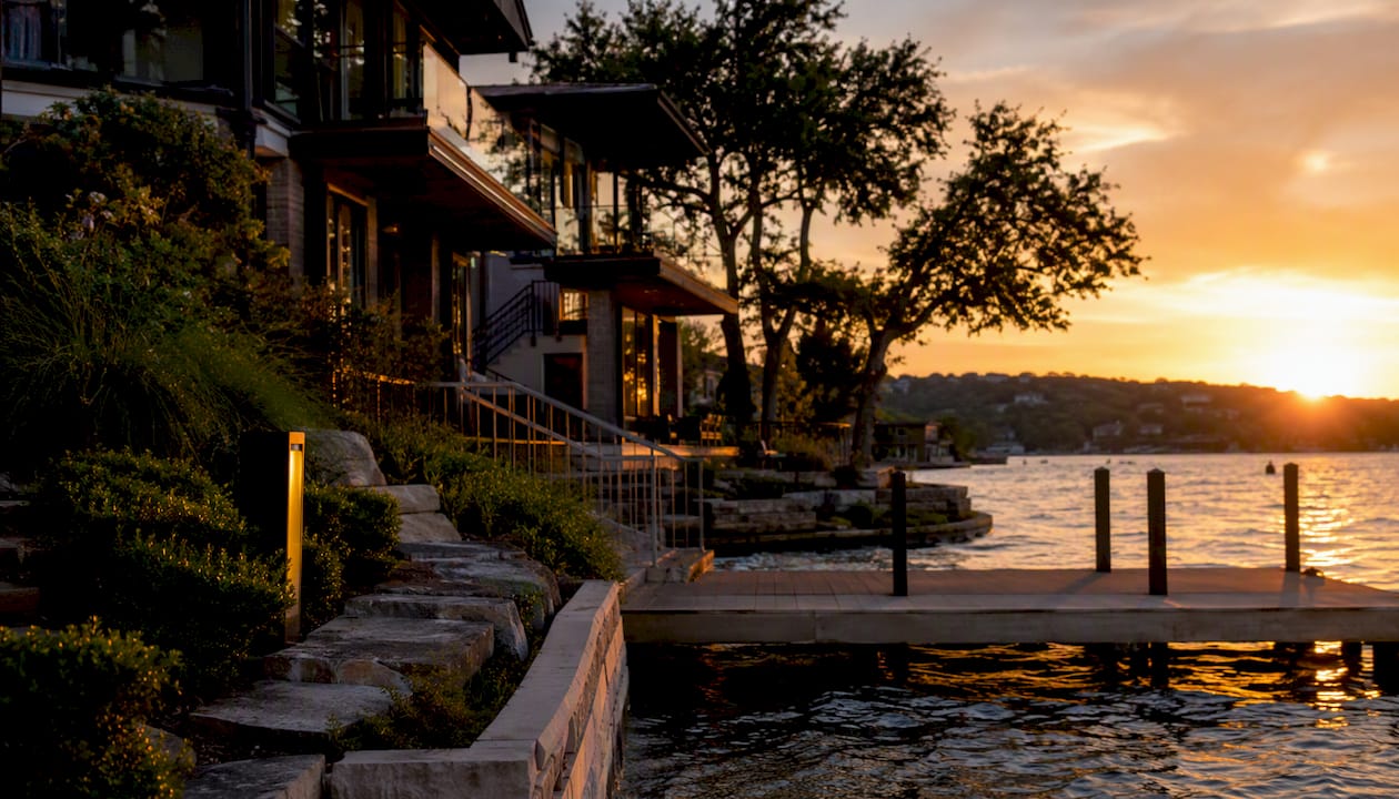 Luxury waterfront home with dock and easement marker