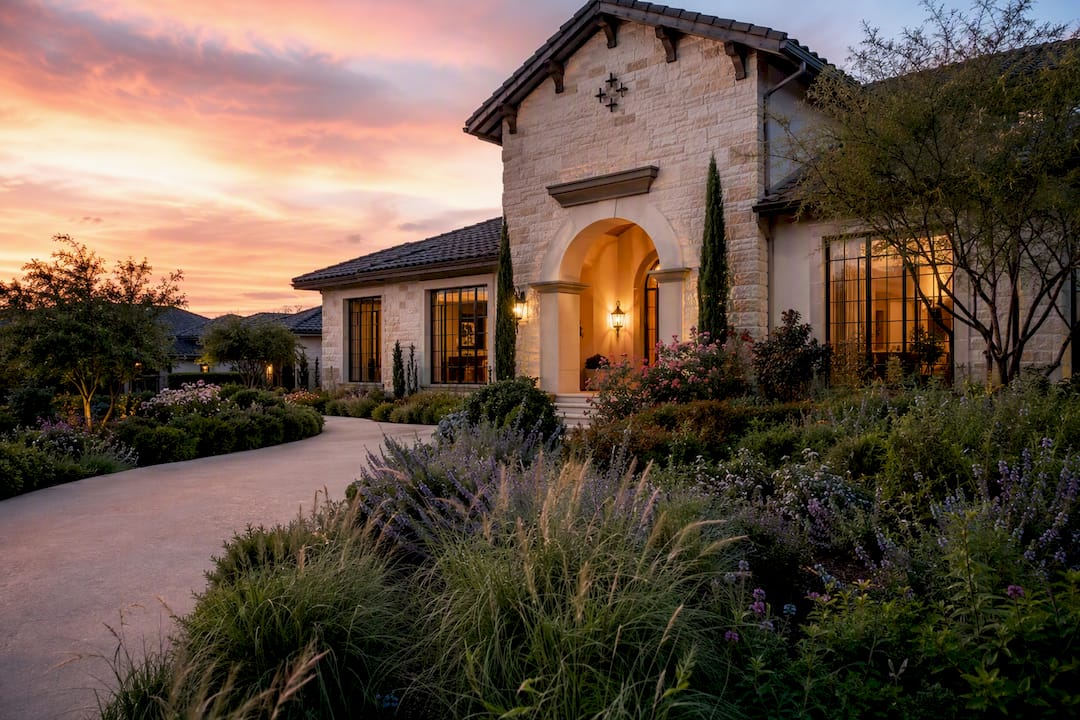 Luxury Texas home exterior with focus on roof and sky