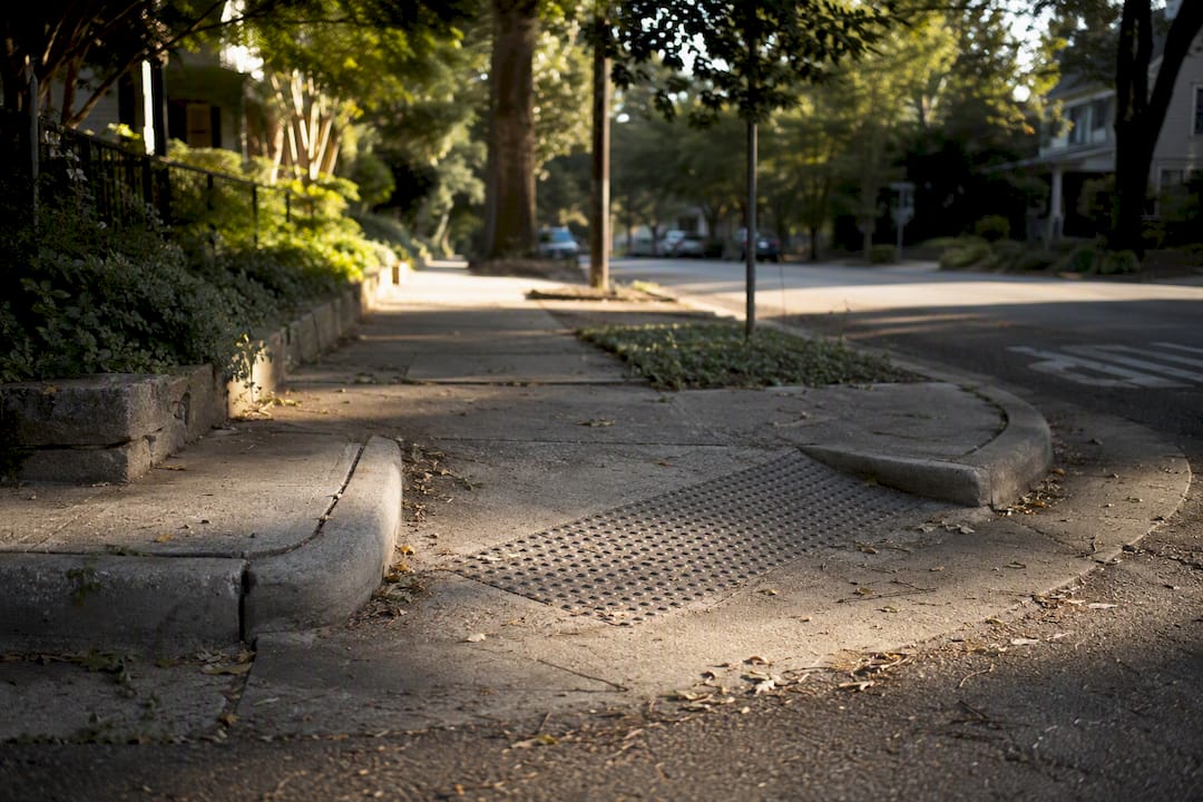 Close-up of Austin sidewalk with curb cut and texture