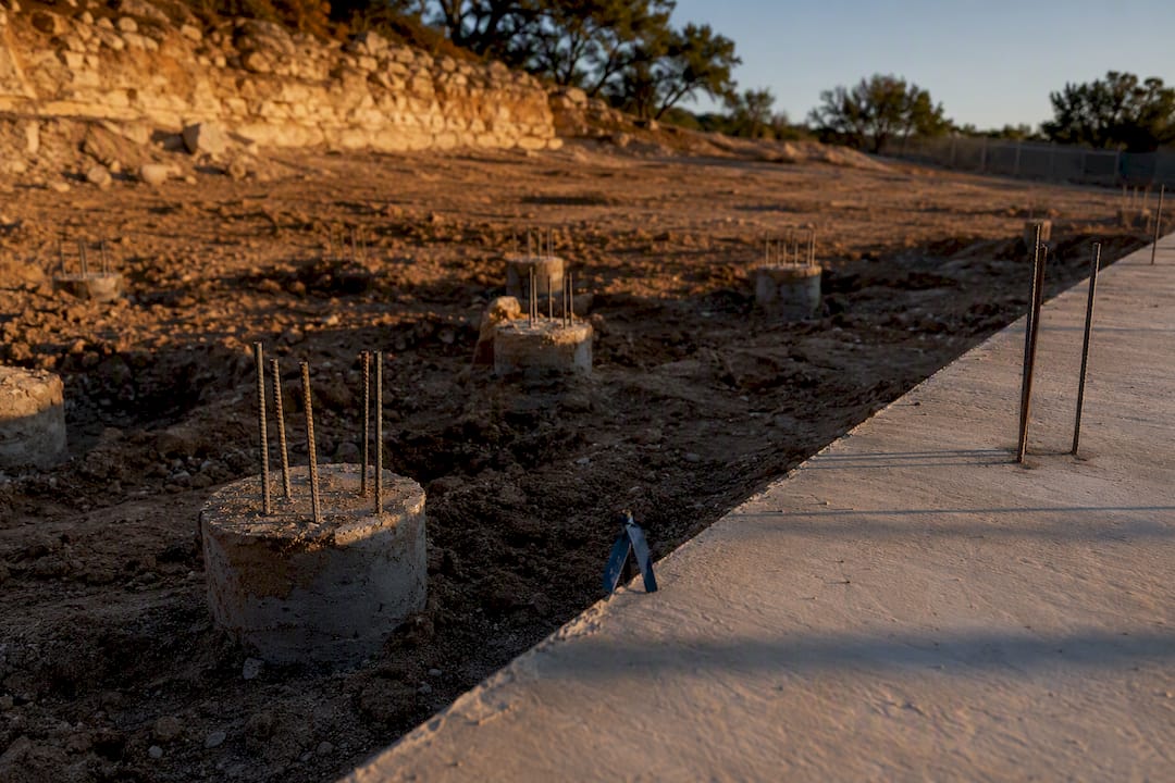 Sloped Austin lot with slab and pier footings