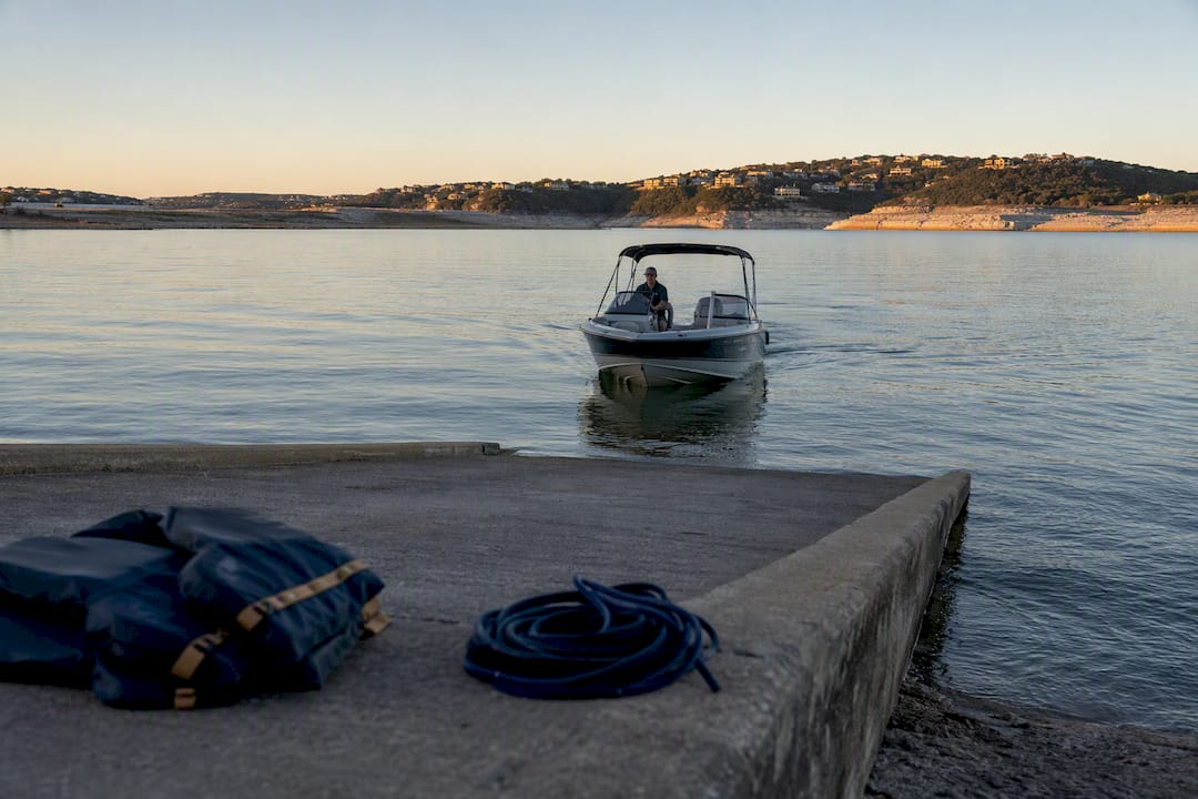 Boat approaching Lake Travis launch ramp