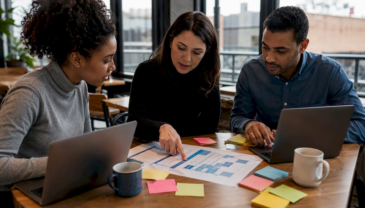 Cross-functional team reviewing buyer enablement roles