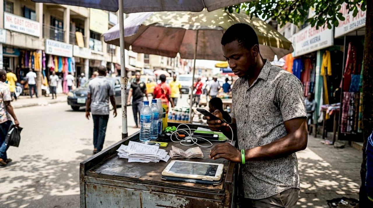 Young entrepreneur working on phone in Lagos