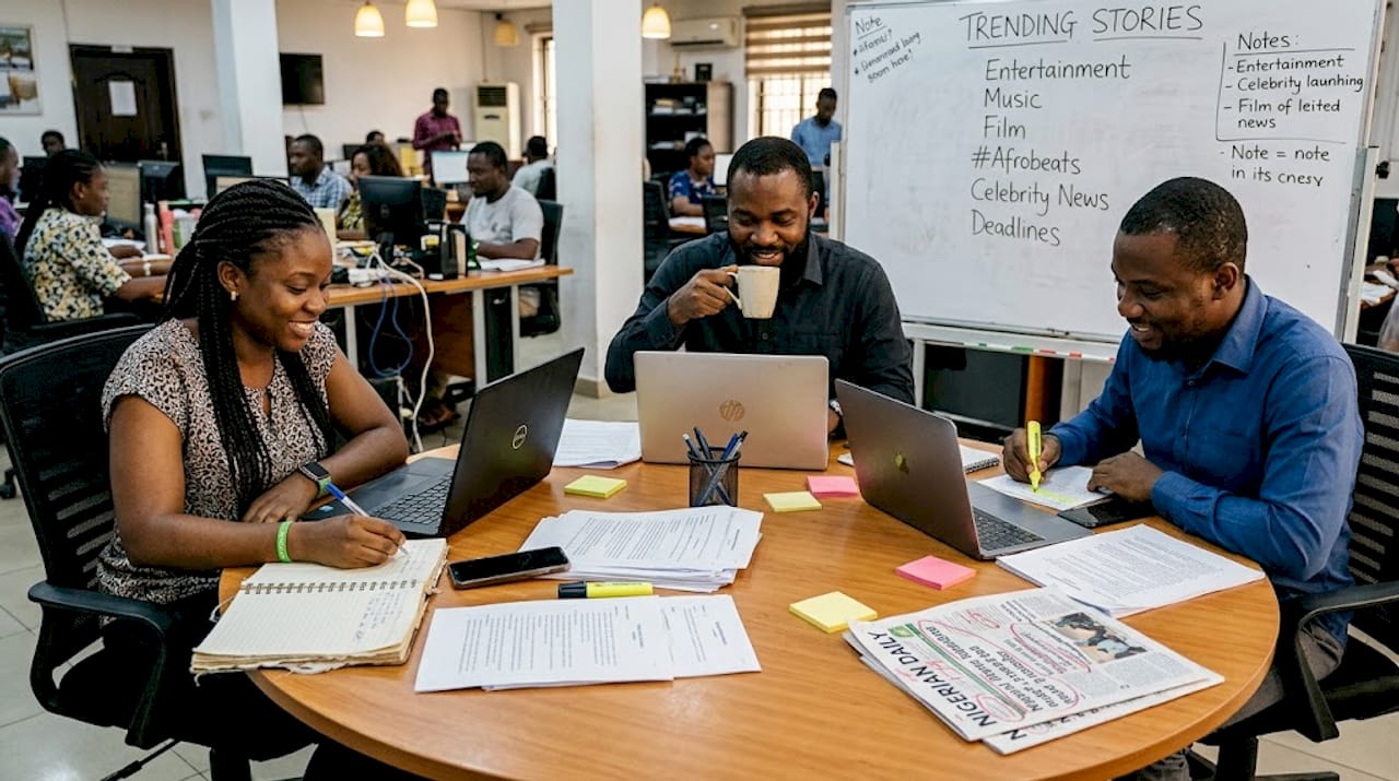 Editors reviewing entertainment news in busy office