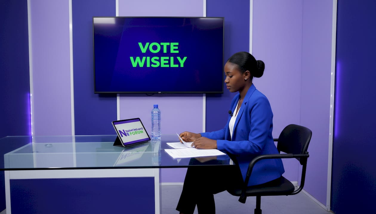 TV presenter preparing voter education segment