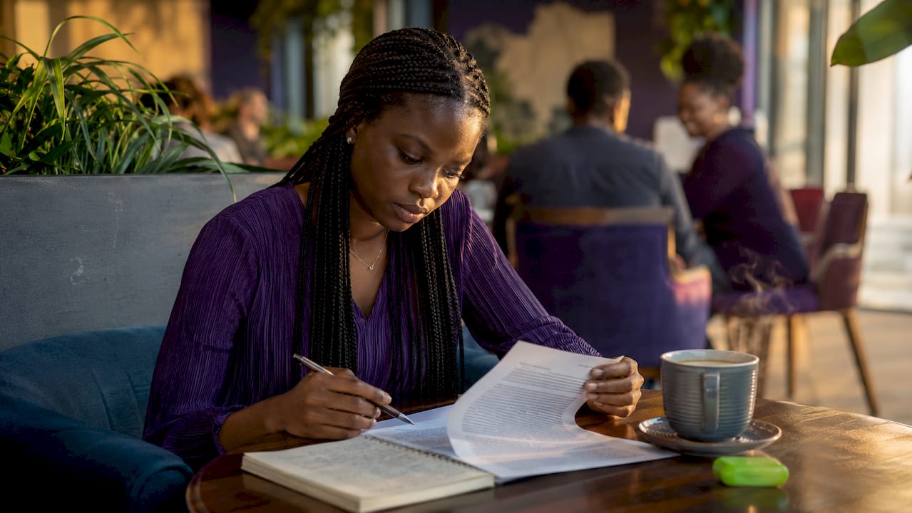 Nigerian woman reading internet privacy document