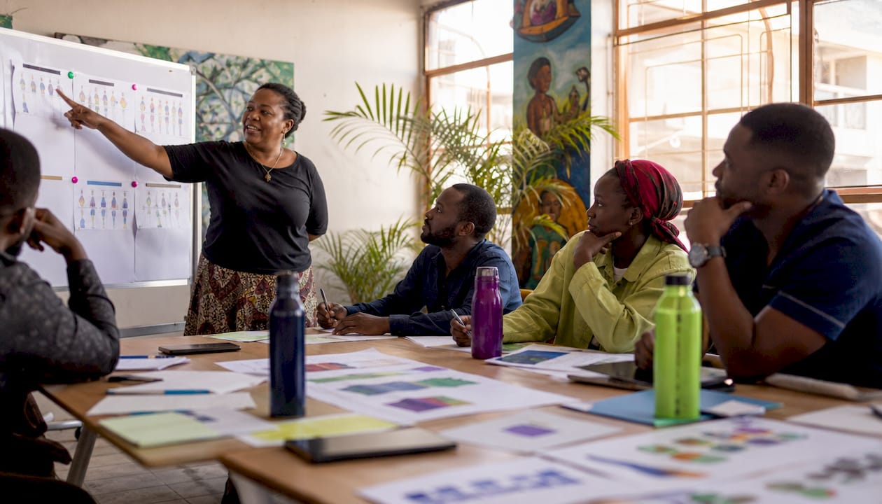 Why Track Social Change: A Guide for Activists 2 Diverse activists discussing social change indicators outdoors