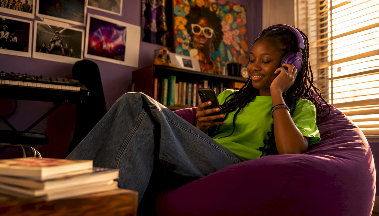 Teen girl with headphones expressing identity through music
