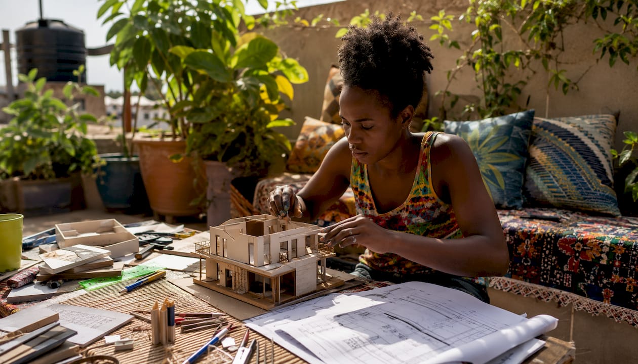 Top 10 Entrepreneurs Every Nigerian Builder Should Know 2 Close-up of hands assembling building model