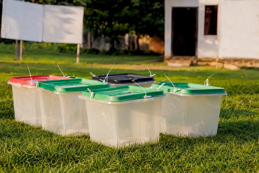 Nigeria Political Parties: The Full Official List for 2026 3 Stacked Nigerian election ballot boxes outdoors