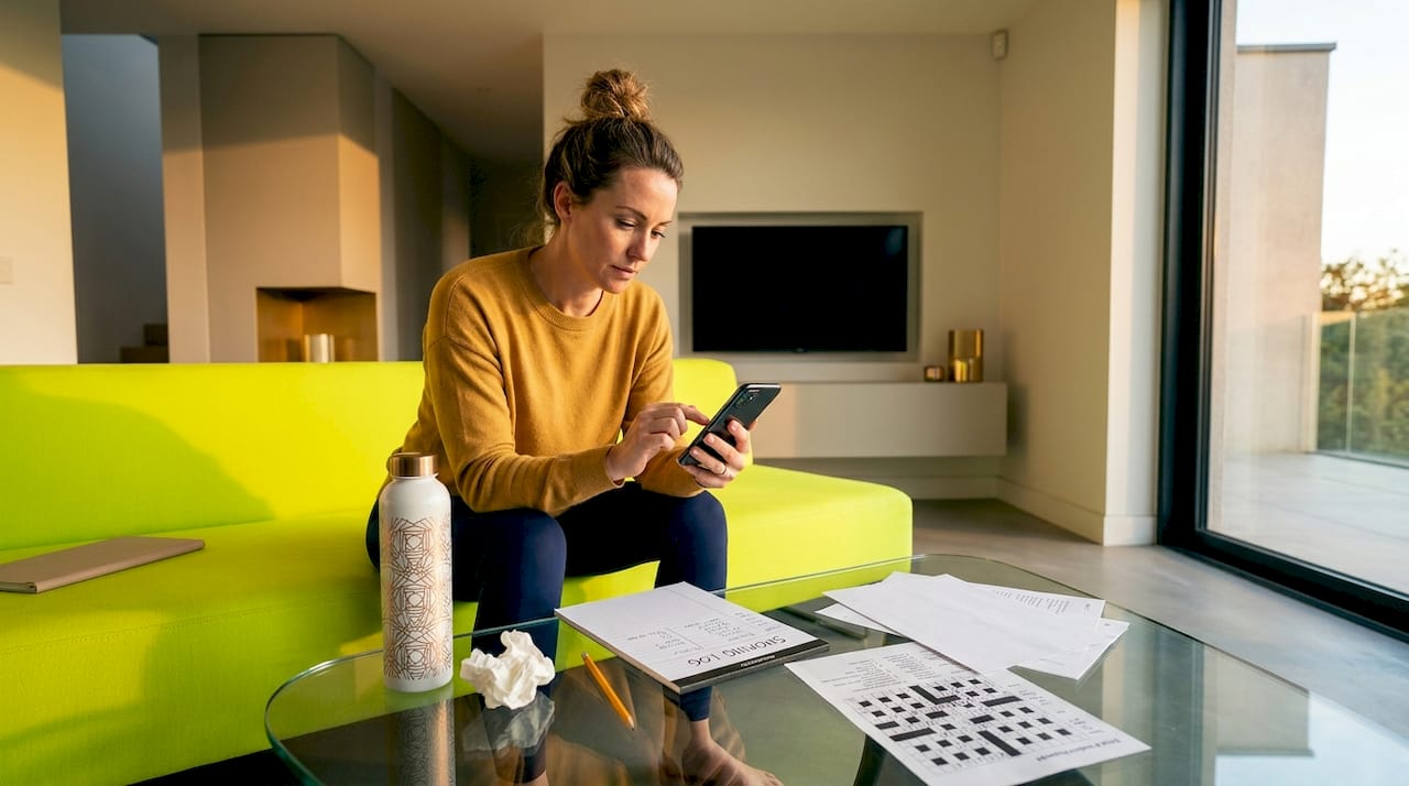 Woman tracking nicotine reduction progress on smartphone