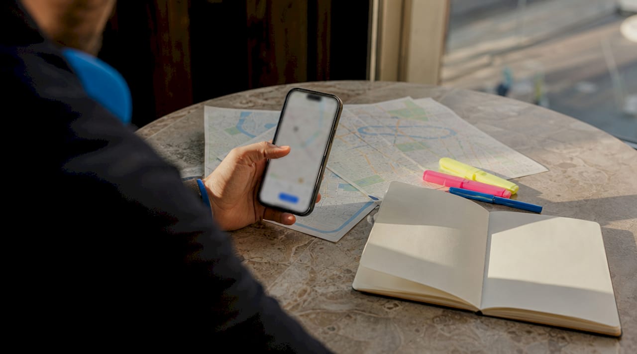 Smartphone and documents on table collecting rideshare evidence