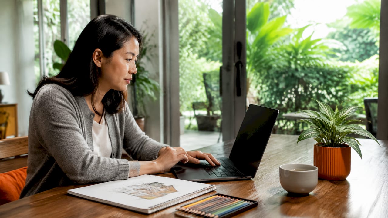 Woman reviewing 3D home renderings