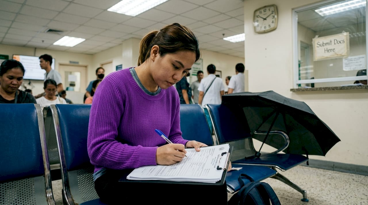 Employee completes HMO claim in clinic waiting area