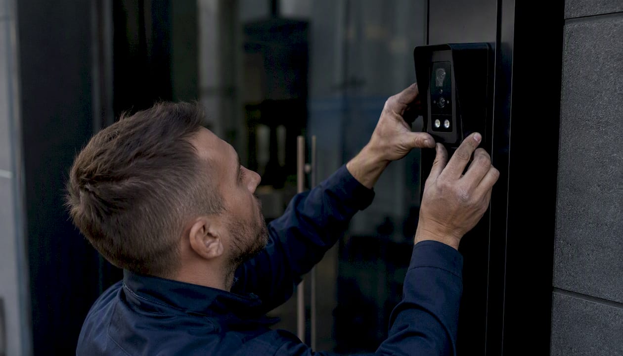 Technician installing face recognition camera