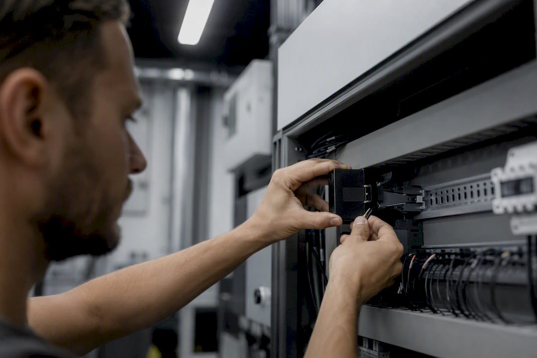 Technician installing sensor hardware
