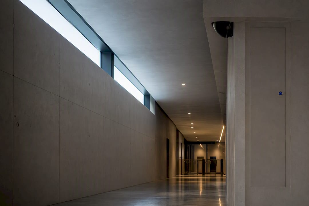 Discreet acoustic sensor in security corridor