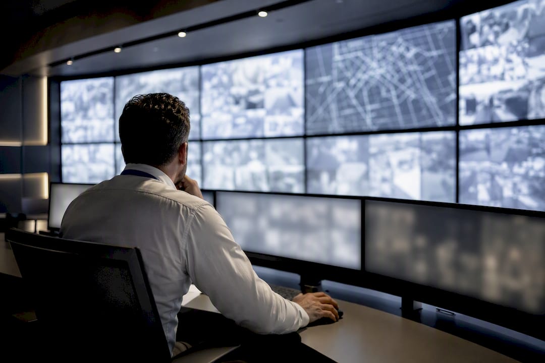 Analyst monitoring smart city surveillance alerts