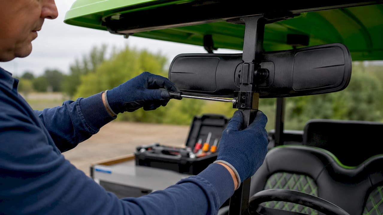 Hands installing panoramic golf cart mirror clamp