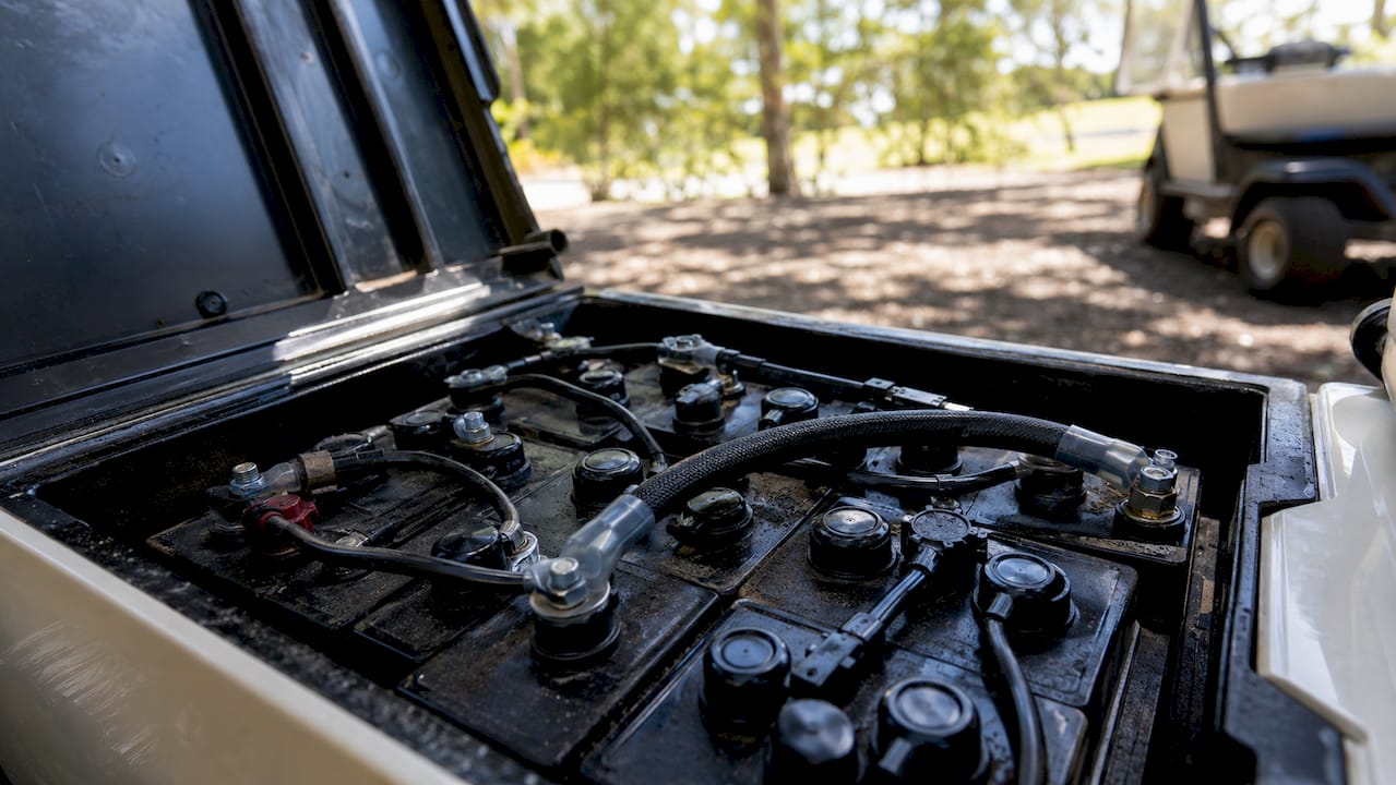 Close-up of electric golf cart battery negative cable