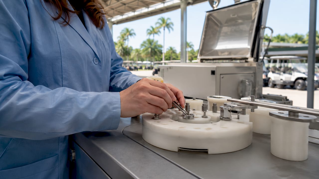 Technician testing marine grade golf cart hardware