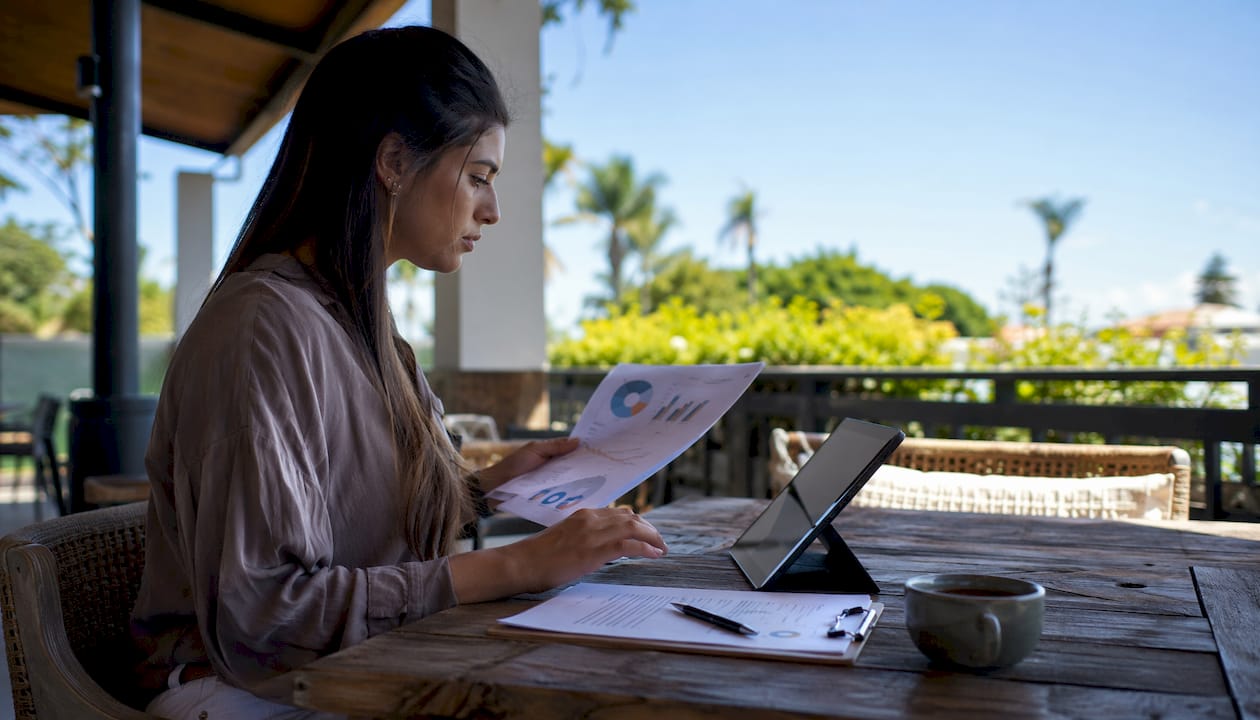 Hands reviewing golf cart bundling market data